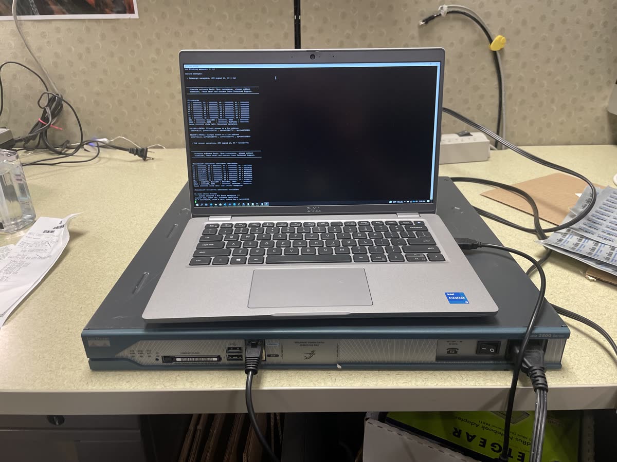 Laptop running diagnostics on a rack switch